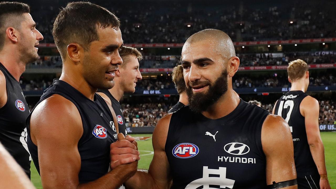 Jack Martin and Adam Saad shake hands post-match.