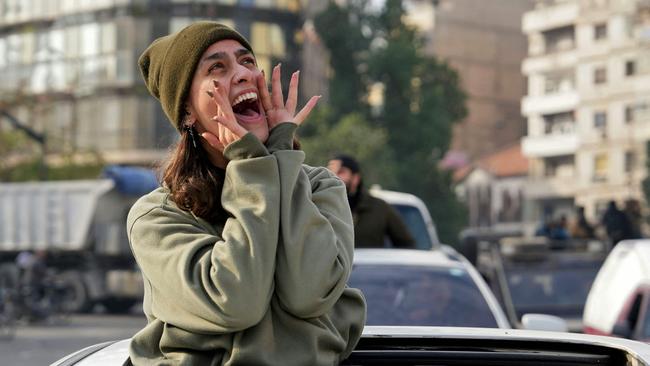 A woman shouts as Syrians celebrate in the central city of Homs. Picture: Muhammad Haj Kadour/AFP