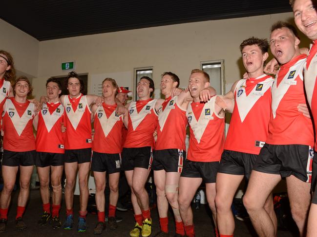 Red Hill players belt out the club song after defeating Langwarrin. Picture: Chris Eastman