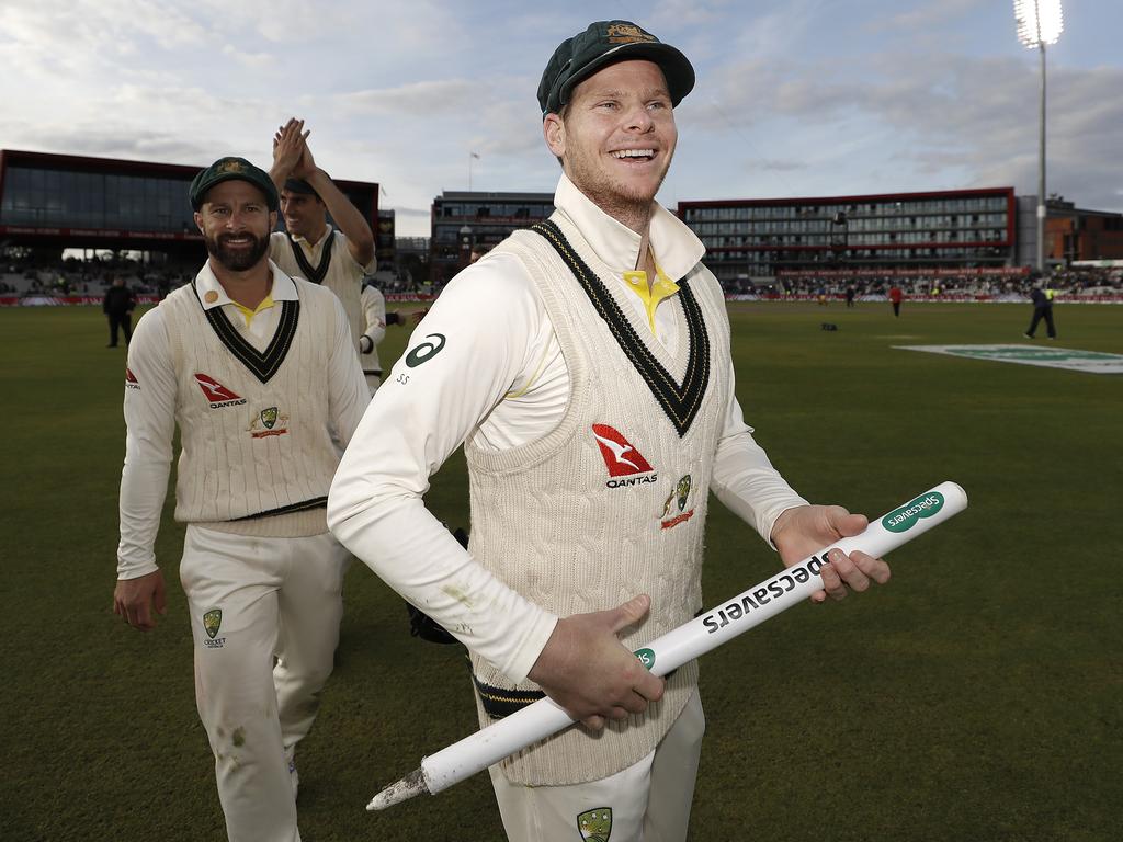 Steve Smith is all smiles as he and his teammates celebrate the victory that retains the Ashes at Old Trafford. Picture: Ryan Pierse/Getty Images