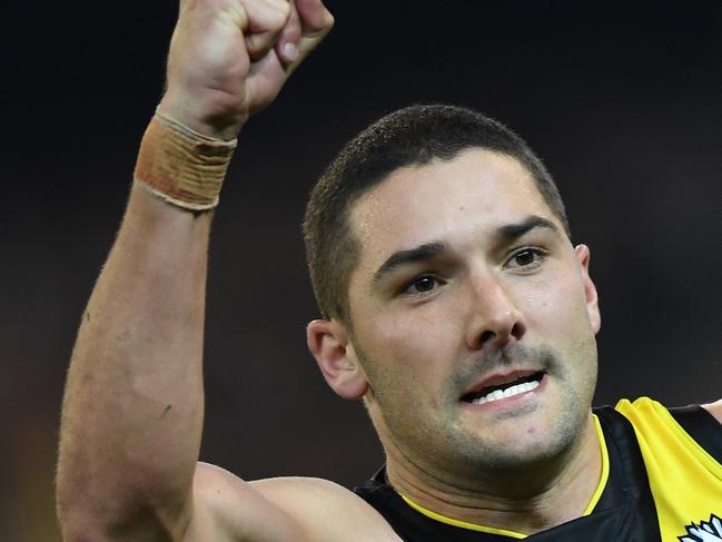 Shaun Grigg of the Tigers reacts after kicking a goal during the Round 5 AFL match between the Richmond Tigers and the Melbourne Demons at the MCG in Melbourne, Monday, April 24, 2017. (AAP Image/Julian Smith) NO ARCHIVING, EDITORIAL USE ONLY