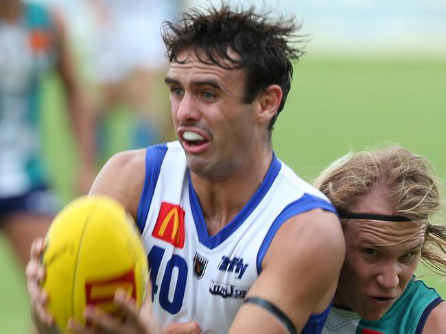 The Sunday TimesWAFL Round 2. Peel Thunder versus East Fremantle Sharks at Rushton Park in Mandurah.The Sharks James Harrold under pressure from Peel's Jake Dowding. PICTURE: LINCOLN BAKER.