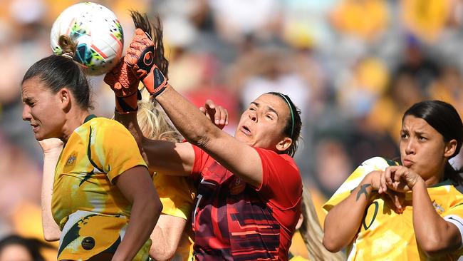 Matilda Lydia Williams (centre) clears the ball during the friendly against Chile on Saturday. Picture: AAP/Dan Himbrechts