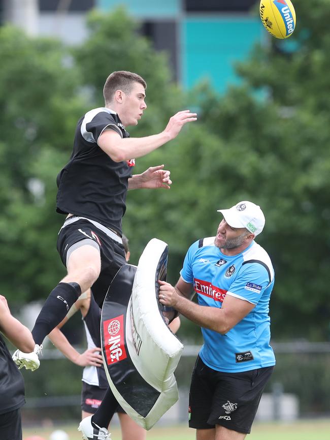 Mason Cox hones his ruckwork at Collingwood training. Picture: David Crosling