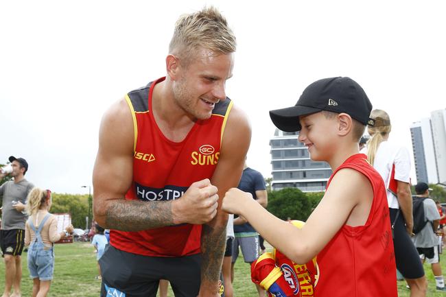 Gold Coast Suns player Brandon Ellis with a fan at Palm Beach. Picture: Tertius Pickard