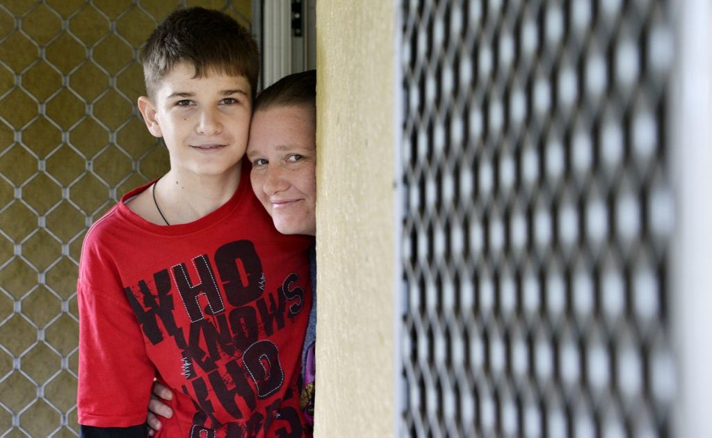 Michael Boggan, 15, photographed with his mother Rebecca at home. Michael was released from hospital a couple of weeks ago and his wounds are healing well. Photo: Claudia Baxter / The Queensland Times. Picture: Claudia Baxter