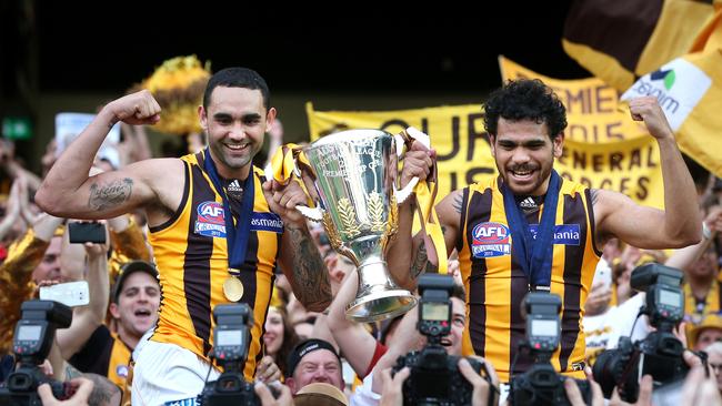 Shaun Burgoyne and Cyril Rioli celebrate the Hawks’ 2015 premiership win against West Coast. Picture: Mark Dadswell