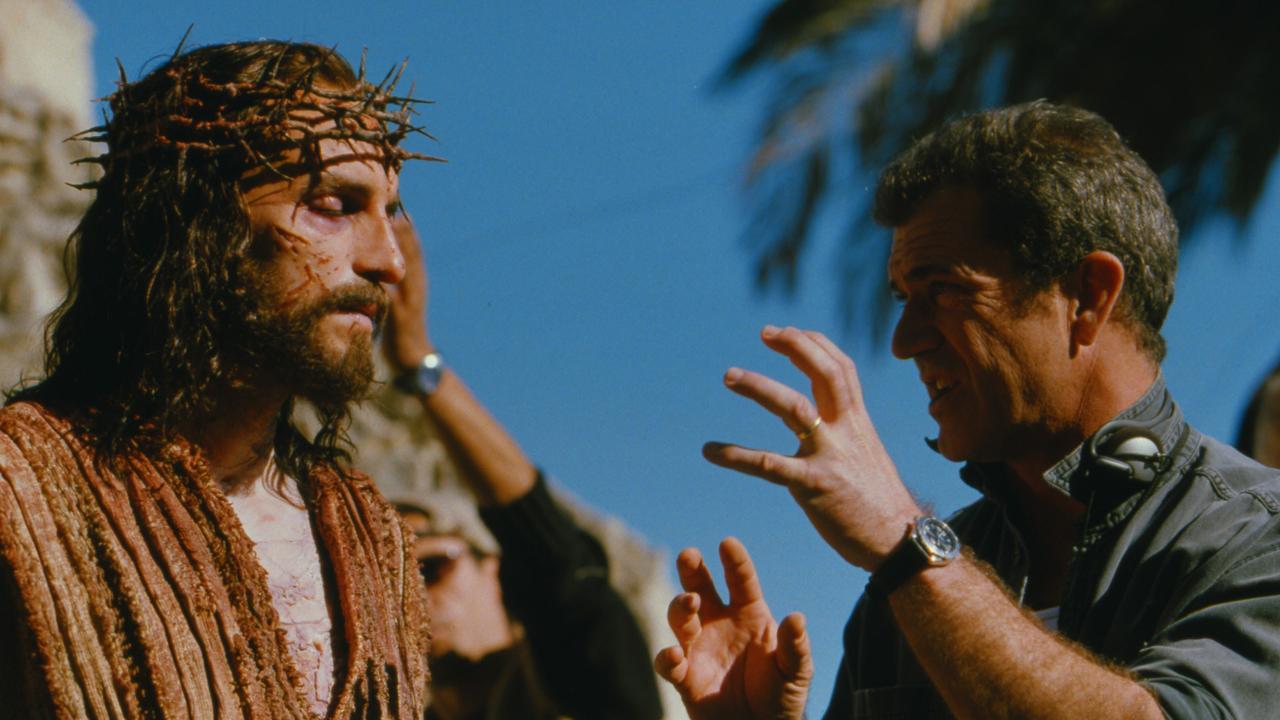 Gibson (right) speaks with actor Jim Caviezel on the set of The Passion Of The Christ.