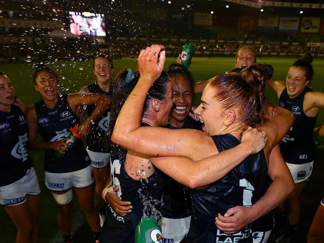 MELBOURNE, AUSTRALIA - FEBRUARY 07:  Grace Egan of the Blue, Vaomua Laloifi of the Blues and team mates  celebrate victory during the round one AFLW match between the Richmond Tigers and the Carlton Blues at Ikon Park on February 07, 2020 in Melbourne, Australia. (Photo by Kelly Defina/Getty Images)