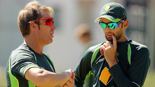 Shane Warne (left) discusses the finer points of spin bowling with Nathan Lyon before a Test match in South Africa in 2014. Picture: Getty Images