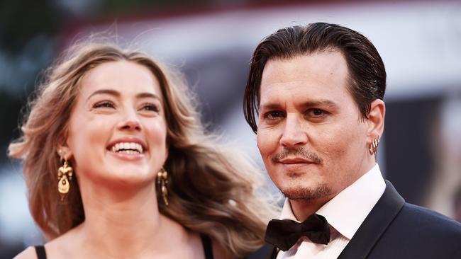 Amber Heard and husband Johnny Depp, pictured in Venice, Italy, in September last year. Picture: Ian Gavan/Getty Images