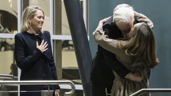 Jennifer Robinson looks on as Julian Assange hugs his wife Stella after they arrived back on Australian soil at the Canberra RAAF base in June. Picture: NewsWire / Martin Ollman