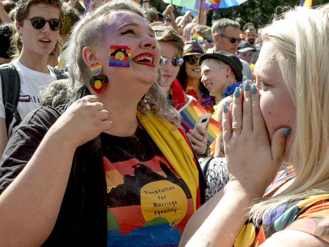 The crowd react to the same-sex marriage postal survey Yes result in front of the State library of Victoria in Melbourne, Wednesday, November 15, 2017. Picture: AAP Image/Luis Enrique Ascui