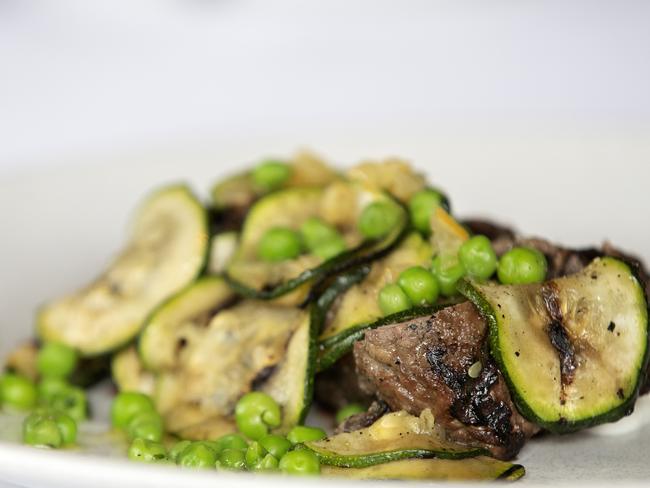 The Astor Grill’s Wild Clover lamb rump with grilled zucchini and peas and mint. Picture: CHRIS KIDD