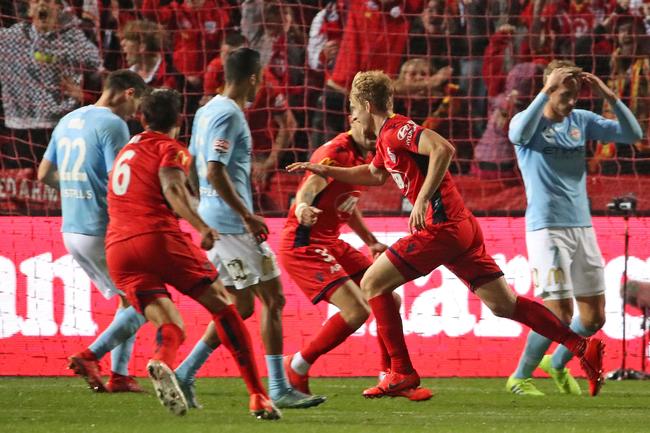 United’s Ben Halloran celebrates after scoring the winning goal as City players look dejected in the A-League elimination final match between Adelaide United and Melbourne City at Coopers Stadium. Picture: Scott Barbour/Getty