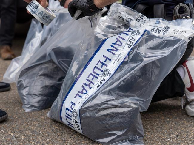 Police evidence bags which will be subject to forensic examination. Picture: AFP