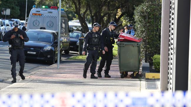 Specialist officers investigating the crime scene on Monday morning. Picture: Max Mason-Hubers