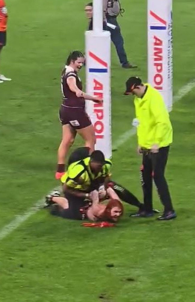 A Vincent man, 24, has been charged after he ran onto the field at the Townsville Women's State of Origin decider.