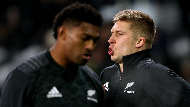 Waisake Naholo and Jack Goodhue of the All Blacks warm up.