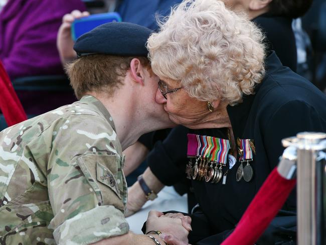 Prince Harry also scored a peck from Daphne Dunne. Pic: Dean Lewins.