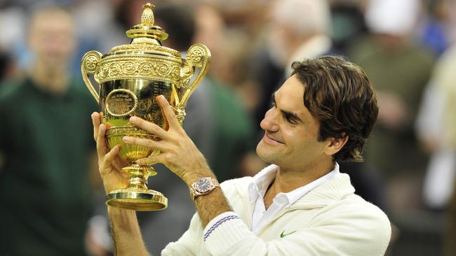 Roger Federer celebrates with the trophy after beating Andy Murray in the 2012 Wimbledon final. Picture: AFP