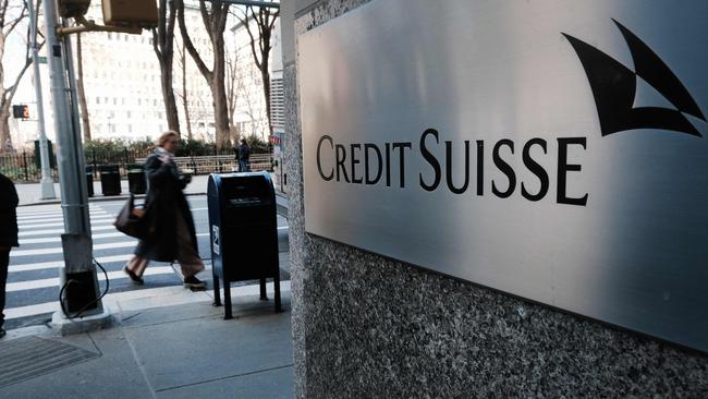 People walk by the New York headquarters of Credit Suisse. Picture: Getty Images via AFP.