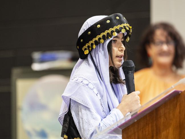 Yezidi community member Year 6 student Dleman Barakat shares her experiences at the Darling Heights State School harmony day celebrations, Thursday, March 21, 2024. Picture: Kevin Farmer