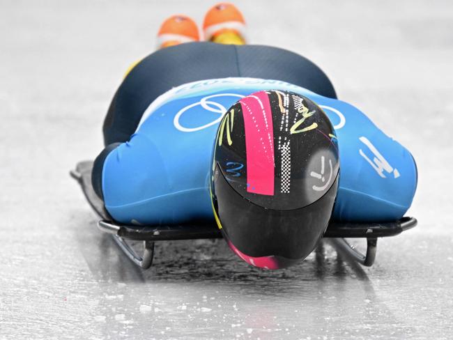 Ukraine's Vladyslav Heraskevych competes in the men's skeleton gold medal event at the Yanqing National Sliding Centre during the Beijing 2022 Winter Olympic Games in Yanqing on February 11, 2022. (Photo by Daniel MIHAILESCU / AFP)