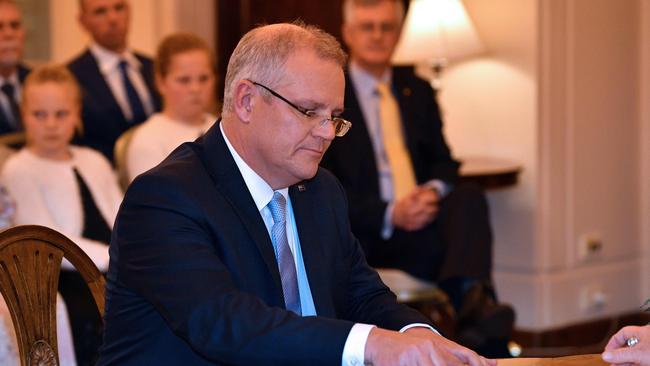 New Australian Prime Minister Scott Morrison is sworn into his new job. He didn’t work to destabilise Turnbull, and loyalty and decency won out. (Pic: Saeed Khan/AFP)