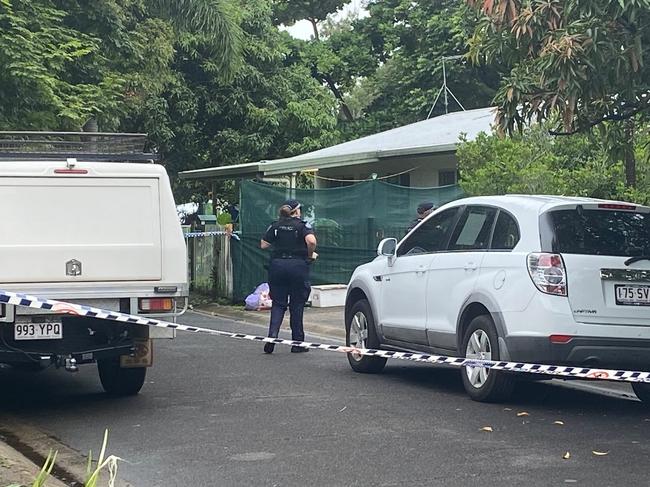 Police gather at the Marchant Street crimes scene where a man was found allegedly stabbed to death on Friday night.