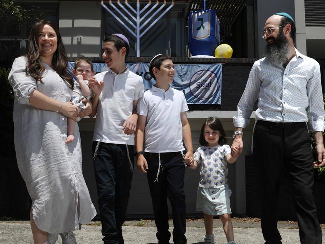 Rabbi Aycee Abrahams and wife Sorella Abrahams with their children in Randwick. For the first time since 2005, Hanukkah falls on Christmas day. Jane Dempster/The Australian.