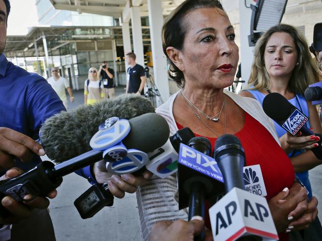 Raghida Dergham, centre, a senior diplomatic reporter at the United Nations updates reporters about her flight aboard an Emirates airline. Picture: AP