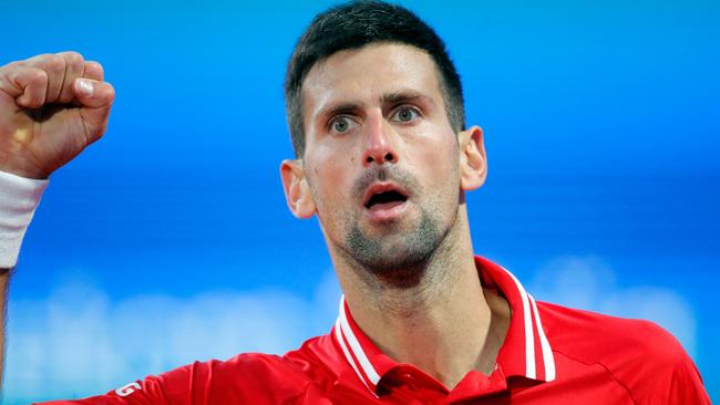 Novak Djokovic will not be able to defend his Australian Open title unless either he or Premier Daniel Andrews change their position Picture: AFP