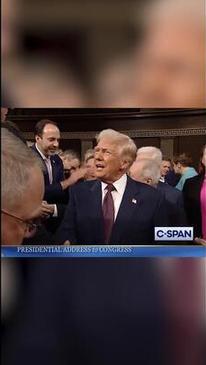 GOP lawmaker grabs 'This is not normal' sign out of Dem reps hands ahead of Trump's speech