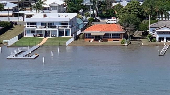 Water laps into the yards of houses across the river from Hamilton. Reader Paul Spottiswood snapped these pics from his Hamilton apartment balcony today about 11.30am, showing how high the tide rose. 