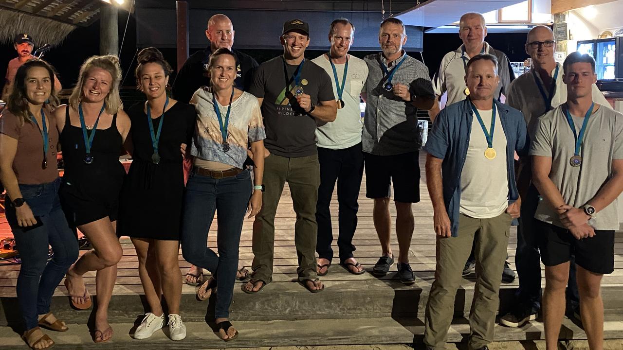 The top three teams celebrate upon completing the inaugural Whitsundays' Toughest Race. From left: Bowen's Megan Mattingley, Jess Snell, Kate Hickey, and Danielle Neden (second place); Bowen's Chris Spargo, Chris Neden, Brett Hetherington, and Dave Jones (first place); and Proserpine's Brian Swan, Steve Keeling, Gary Lee and Ivan Simmons. Photo: Supplied.