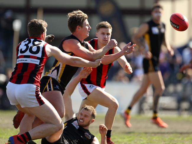 Charlie Haley gets a handball out under pressure. Picture: Stuart Milligan