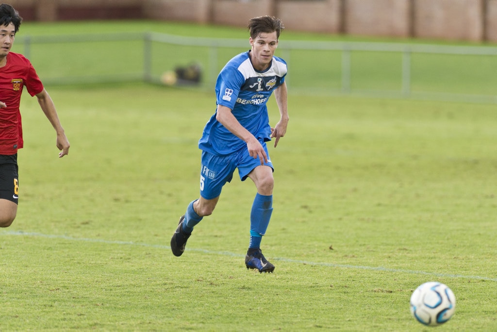 South West Queensland Thunder player Wade Hall and Kirito Higuchi (left) of Sunshine Coast Fire race for possession in NPL Queensland men round nine football at Clive Berghofer Stadium, Saturday, March 30, 2019. Picture: Kevin Farmer