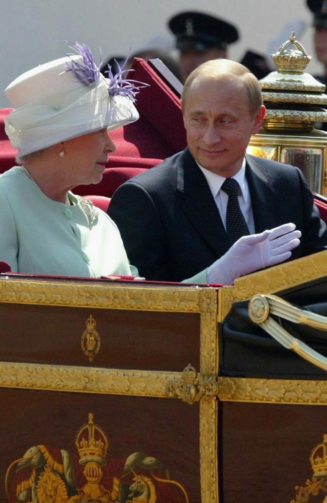 Queen Elizabeth II with Russian President Vladimir Putin taking the royal coach to Buckingham Palace in 2003.