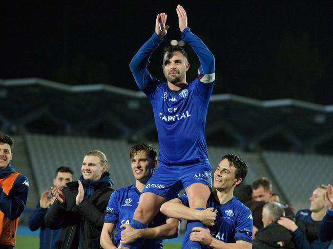 Brad Norton is chaired off after his 300th game. Picture: Mark Avellino