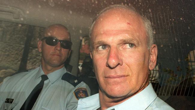 Arthur Neddy Smith guarded by correctional officers leaves Supreme Court, in 1999. Picture: Newspix