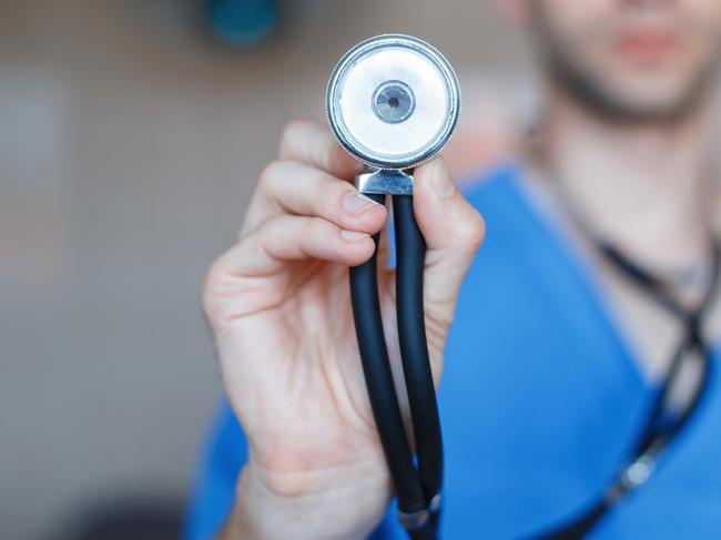 Doctor holding a Phonendoscope in his hand. Checks the health of the patient