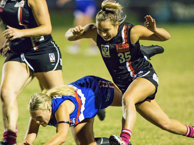 Frankston’s Maddison Hocking (right) goes after the ball last Friday night. Picture: Alan Dillon