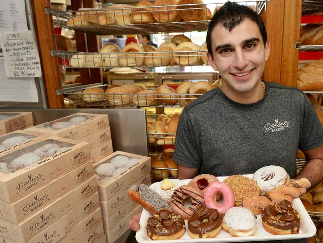 Mmmm. Daniel Bartalotta and his doughnuts at Daniel's Bakery. Picture: Kris Reichl