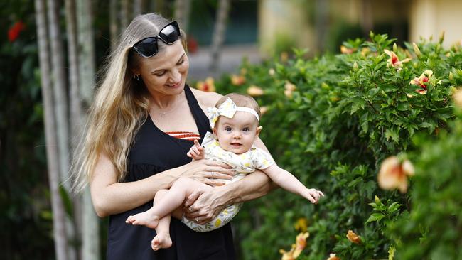 Sarah Taylor and her partner Lucas Cosgrove moved to Cairns four years ago and decided to to settle, welcoming their first child, Tallulah, seven months ago. Picture: Brendan Radke