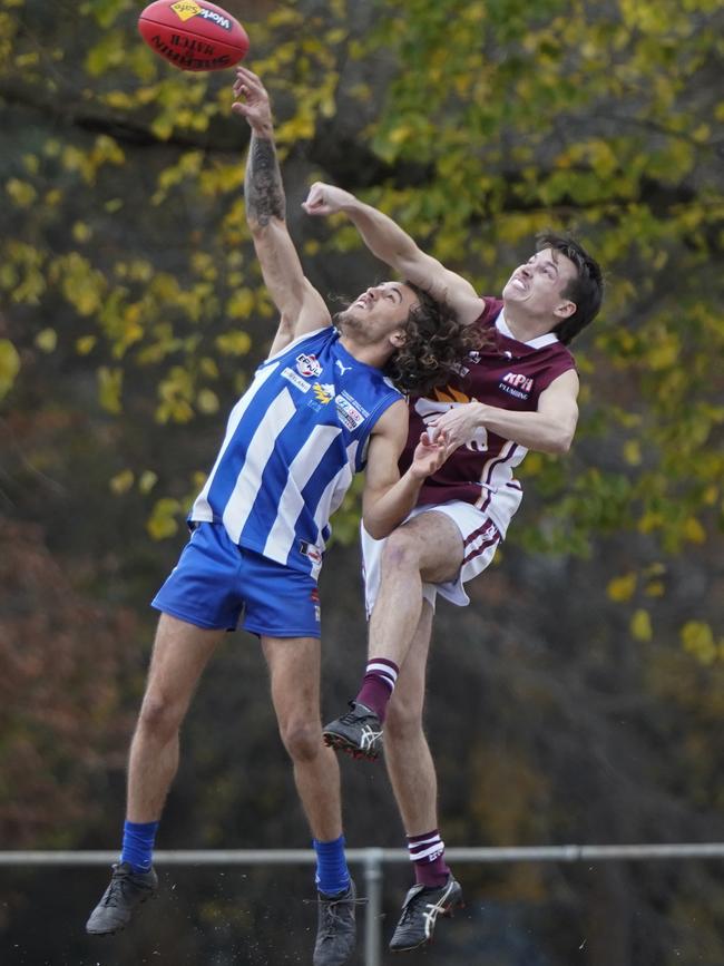 EFL: Ferntree Gully’s Jayden Brown is spoiled by Luke Morando of Whitehorse. Picture: Valeriu Campan