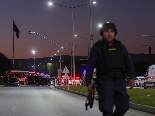 A member of the Turkish Jandarma stands guard at the entrance of the Turkish Aerospace Industries facility after an attack. Picture: Getty Images.