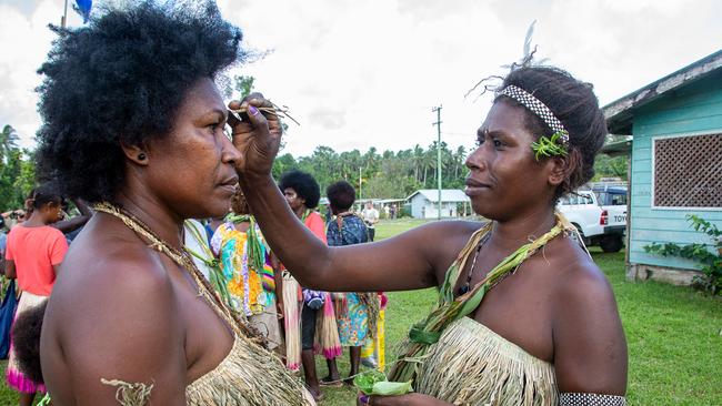 Bougainvillean women put flowers in their hair on polling day. Picture: AFP