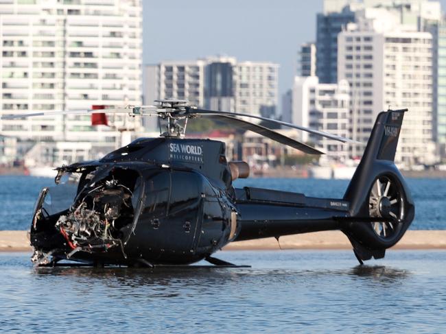 GOLD COAST, AUSTRALIA - NewsWire Photos JANUARY 3RD, 2023:  03 January 2023 - Gold Coast Helicopter Crash: Queensland Police and ATSB Officers recover the wreckage after four people were killed and many more injured after two helicopters collided near Sea World on the GoldCoast, 03 January 2023.Picture Scott Powick