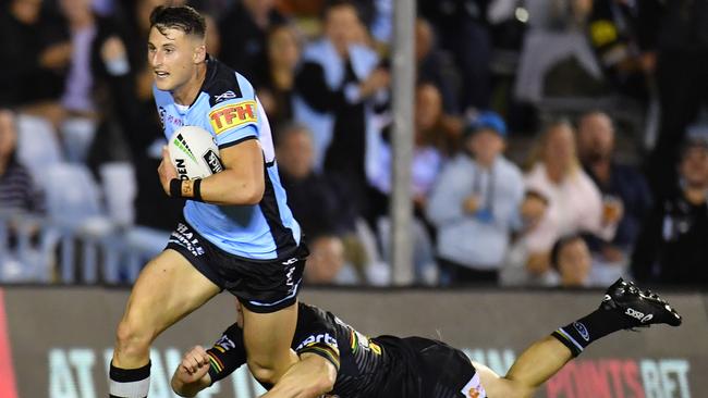 Bronson Xerri breaks away to score a try for the Sharks. Picture: AAP
